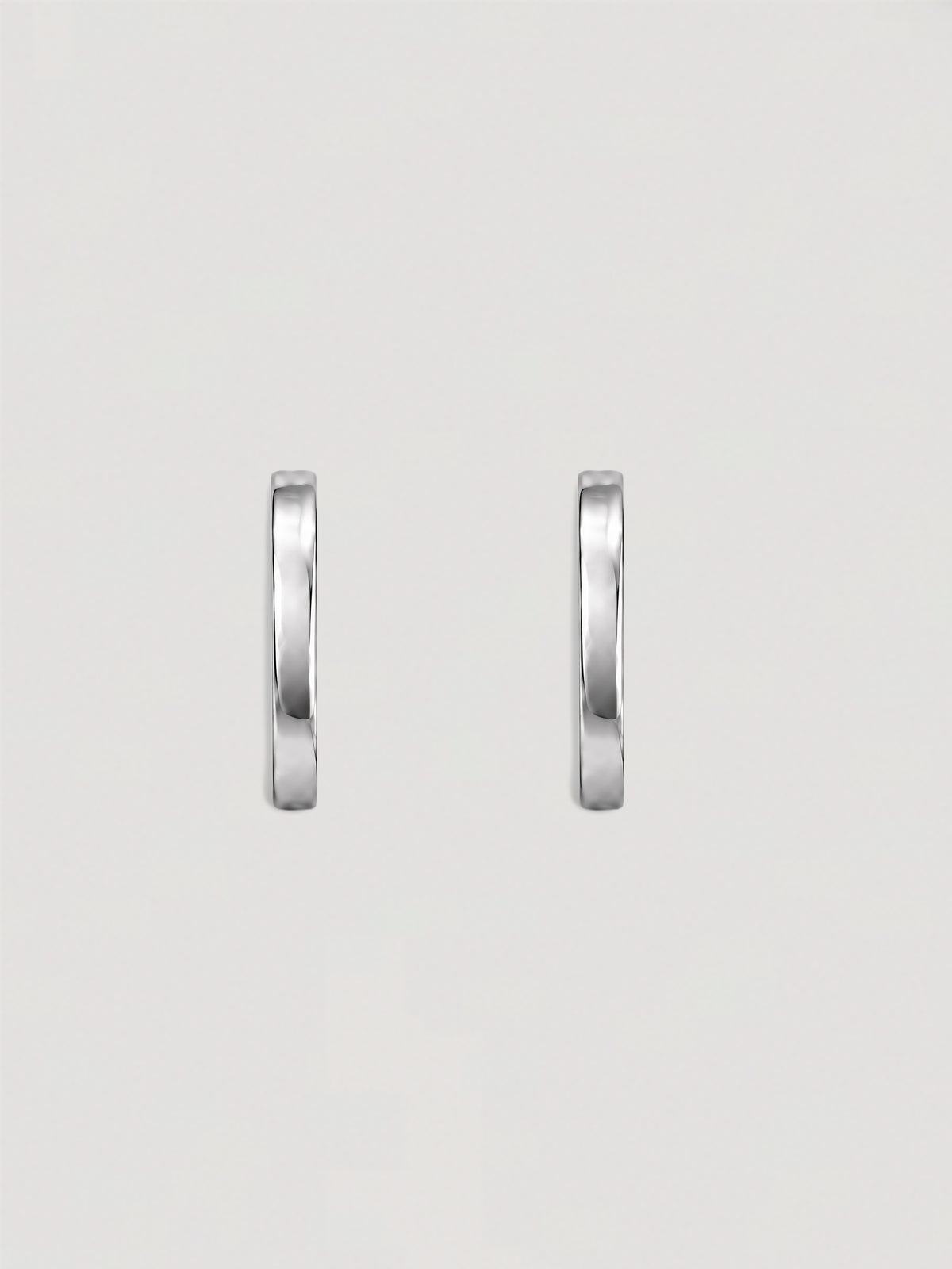 ELONGATED SILVER HOOP EARRINGS
