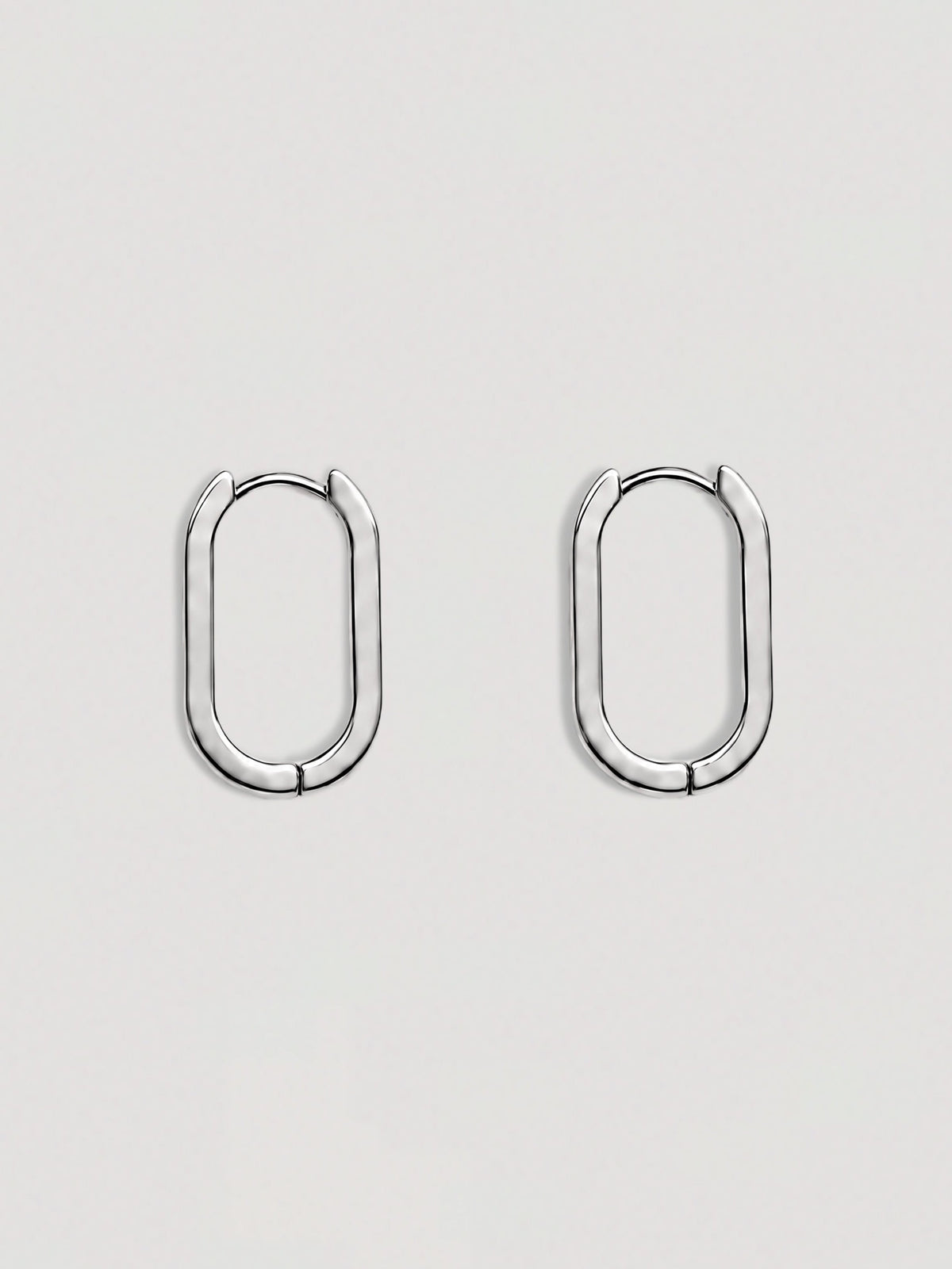 ELONGATED SILVER HOOP EARRINGS